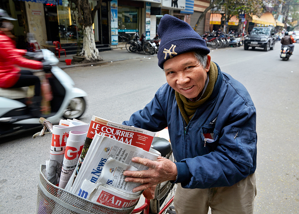 Man selling newspapers in Ho Chi Minh City Digital Download