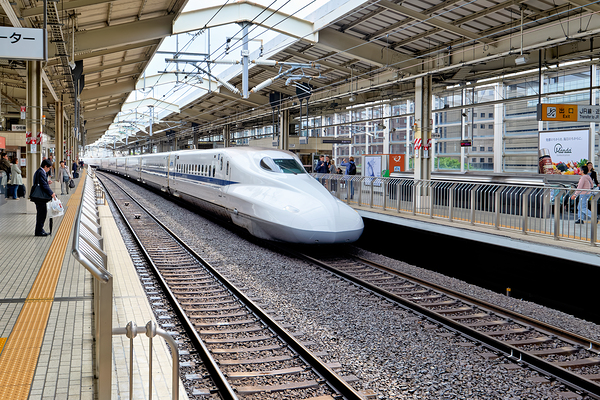 Shinkansen arrives at Kyoto Station in Japan during daylight Digital Download