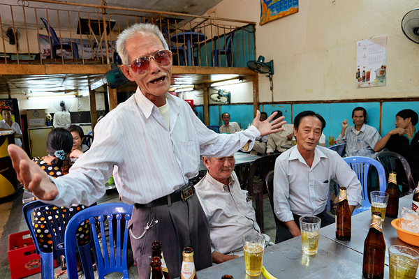 Men gather in Ho Chi Minh Vietnam for drinks and conversation Digital Download