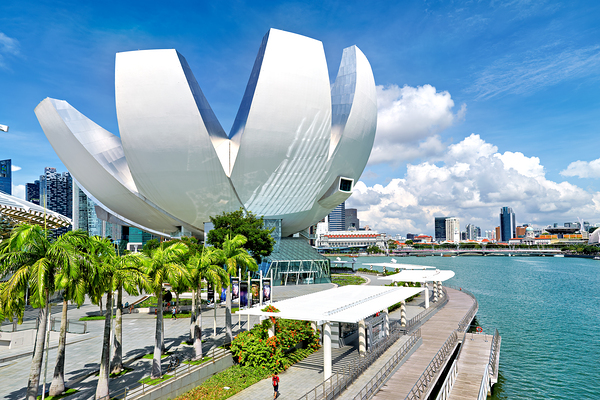 Visitors enjoy view of ArtScience Museum in Singapore near water Digital Download