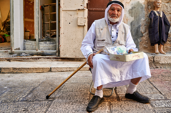 Old man sits in the old city of Jerusalem asking for help Digital Download