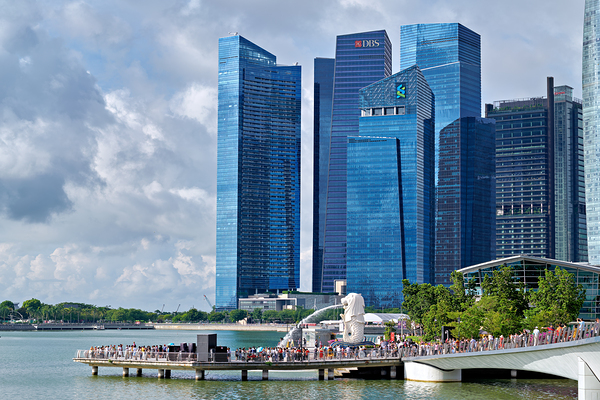 People are walking near a bridge in Singapores financial distri Digital Download