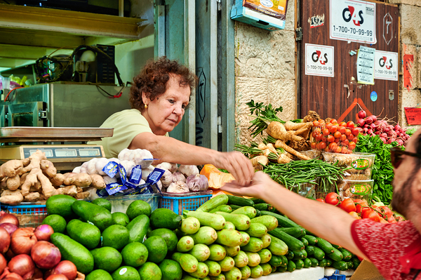 Local vendor sells fresh produce in Mahane Yehuda Market Digital Download