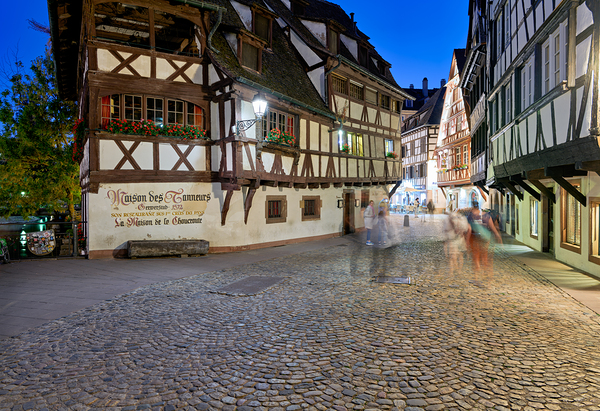 Colorful timber houses and people walking in Strasbourg at night Digital Download