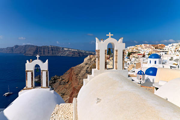 Santorinis iconic white churches blue domes and caldera view. Digital Download