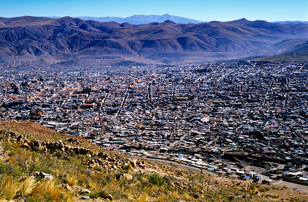 Panoramic view of a sprawling city in a mountain valley. Digital Download