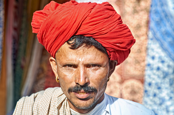 Man in red turban poses in Rajasthans Jaisalmer market street Digital Download