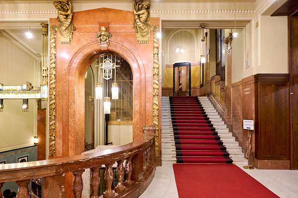 Elegant interior with red carpeted staircase and ornate gold det Digital Download