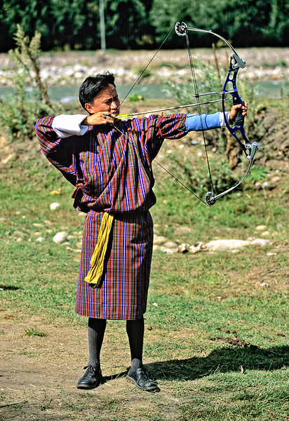 Bhutanese archer in traditional Gho aiming a compound bow. Digital Download