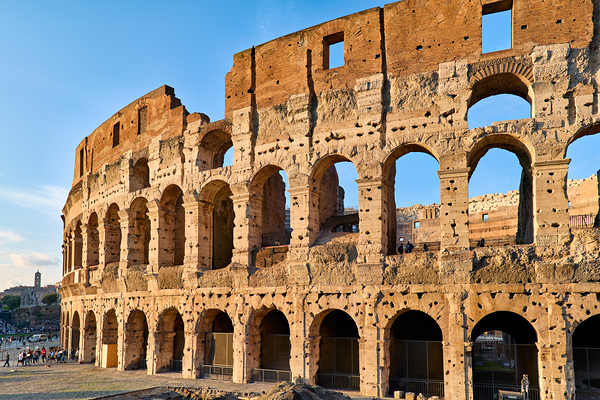 Colosseum stands tall in Rome during golden hour Digital Download