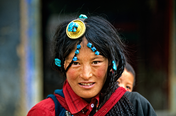 Traditional woman carries child in Tibet with ornate hair decora Digital Download