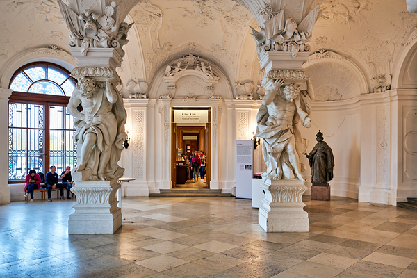 Ornate Baroque hall with sculptures and visitors. Digital Download