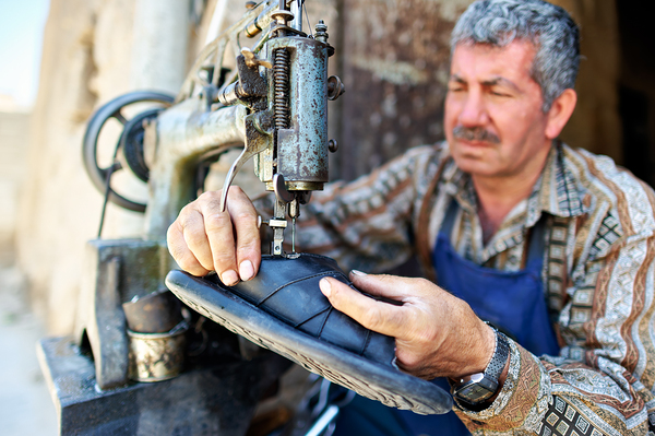 Shoemaker working in Aleppo souq in Syria Digital Download
