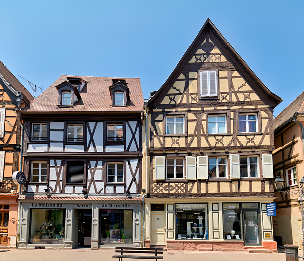Visitors explore timber framed houses in Colmar Alsace on a sun Digital Download