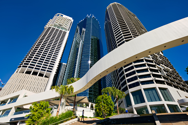 Woman walks on stairs in modern urban area with tall buildings Digital Download