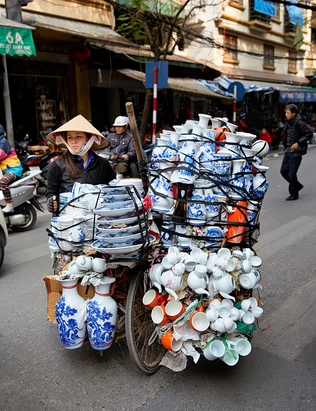 Woman transports pottery on a bicycle in Hanoi streets Digital Download