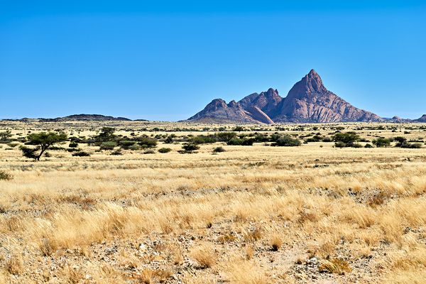 Granite peaks of Spizkoppe rise above the Namib Desert in Namibi Digital Download