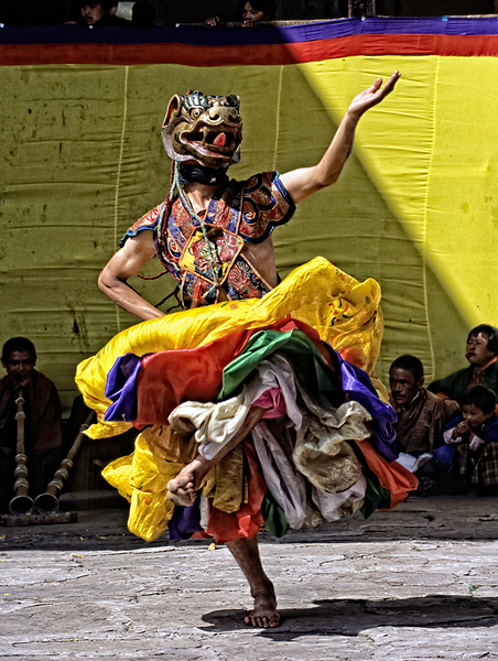 Vibrant masked dancer performs traditional dance. Digital Download