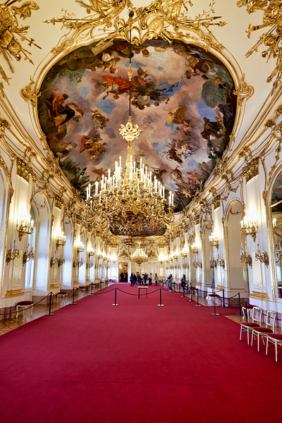 Ornate palace hall with chandeliers painted ceiling and red ca Digital Download