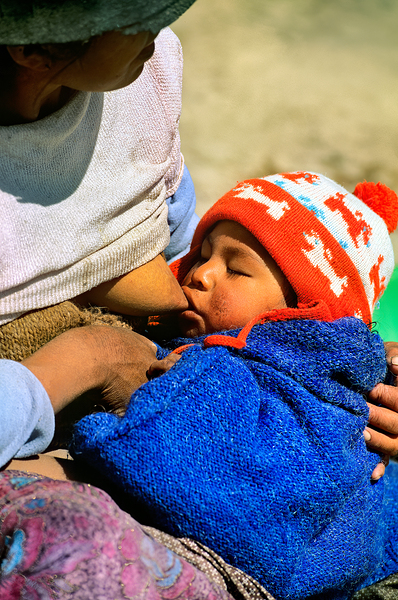 Indigenous mother nourishes child in the Andes of Argentina Digital Download