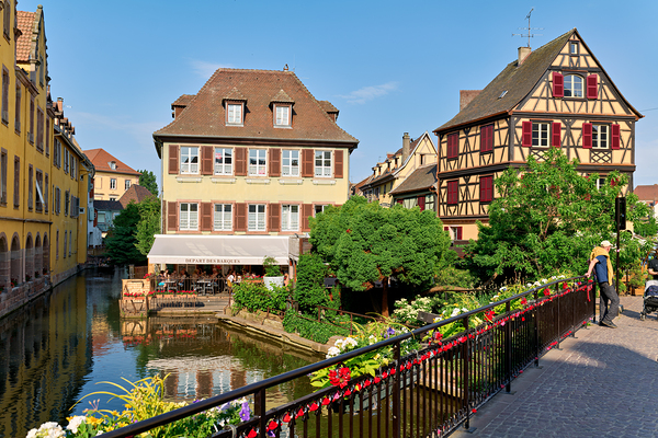 Visitors stroll by timber framed houses along the canal in Colma Digital Download