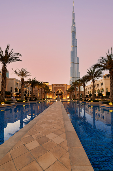 Burj Khalifa towers over pool and traditional buildings in Dubai Digital Download