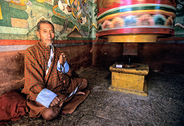 Bhutanese man with prayer beads and spinning prayer wheel. Digital Download