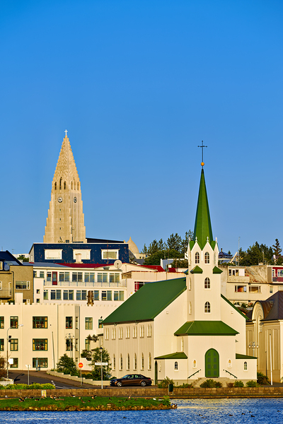 Lutheran free church by lake Tjornin and Halgrimskirkja Digital Download