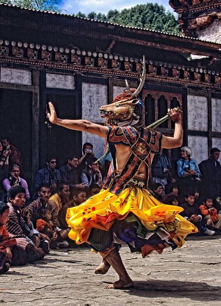 Bhutanese masked deer dancer performs for an attentive audience. Digital Download