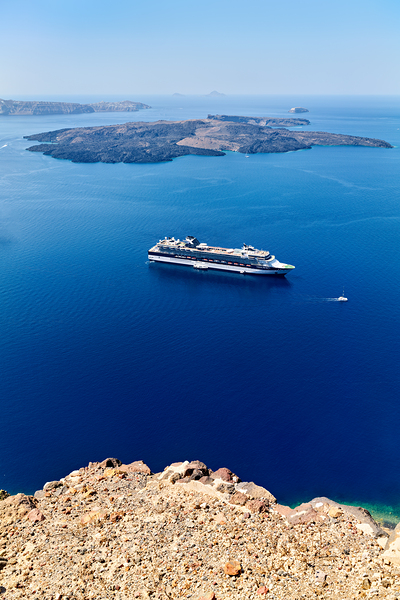Cruise ship in deep blue sea volcanic islands rocky foreground Digital Download