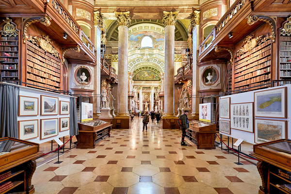 Grand ornate library interior with books columns and visitors Digital Download