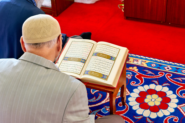 Man reading Quran inside Fatih Mosque in Istanbul Turkey Digital Download