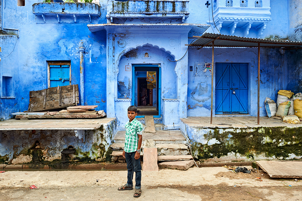 Decorated painted house in Bundi with a boy standing outside Digital Download