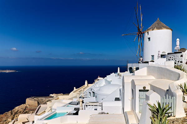 Santorinis iconic white architecture and windmill against the d Digital Download