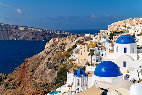 Santorinis iconic white buildings and blue domes overlooking th Digital Download
