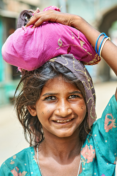 Portrait of a young girl carrying cloth in Mandawa Rajasthan Digital Download