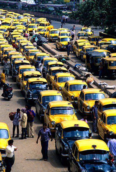 Taxi parking in Kolkatas busy streets during daytime Digital Download