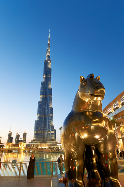 Burj Khalifa and golden horse statue at dusk in Dubai Digital Download