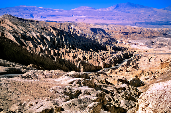 Eroded desert landscape with a road winding through mountains. Digital Download