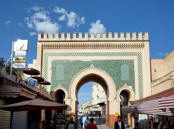 People walk through Bab Bou Jeloud a famous gate in Fez Morocc Digital Download