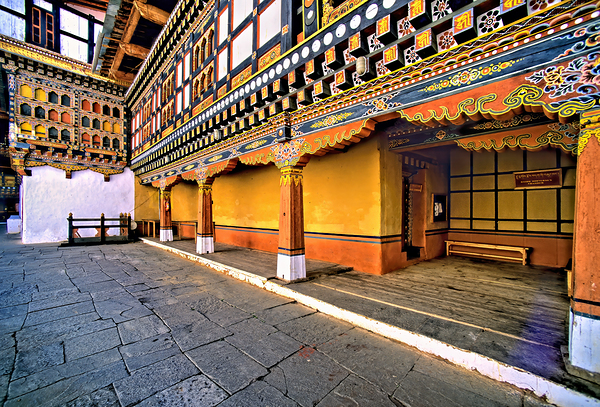 Vibrant ornate Bhutanese temple architecture and stone courtyar Digital Download