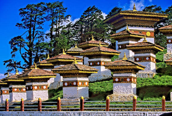 Druk Wangyal Chortens Bhutan with lush trees and blue sky. Digital Download