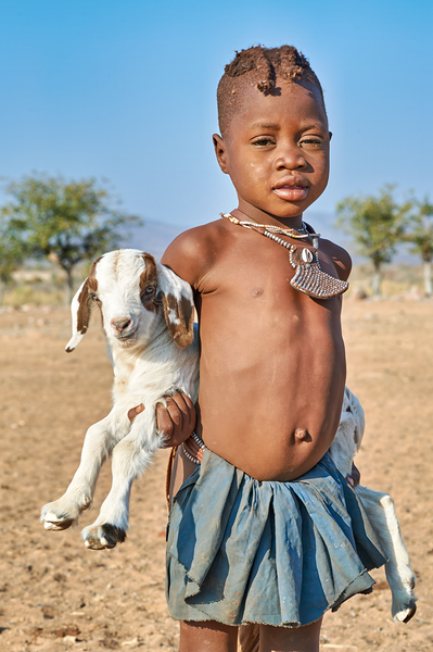 Himba child holding a goat in Kunene Region of Namibia Digital Download