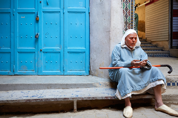 Portrait of a beggar sitting by a blue door in Fez Morocco Digital Download