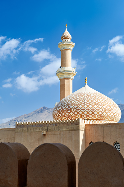 Nizwa Fort shows mosque and tower with blue sky and clouds Digital Download