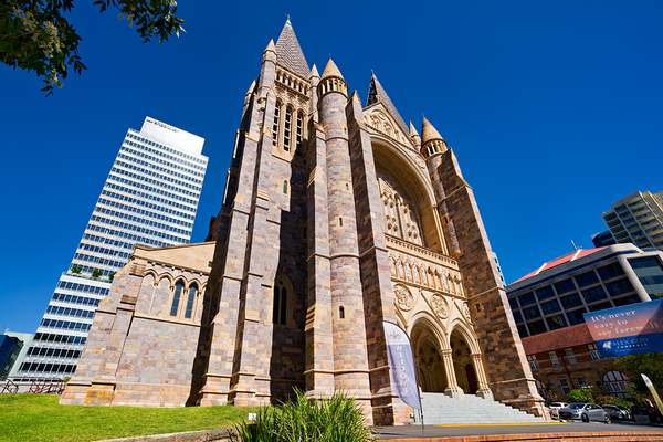 Historic church stands tall next to modern skyscrapers. Digital Download
