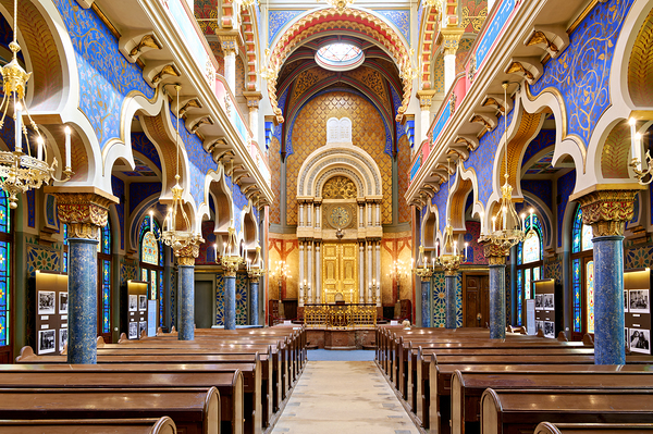 Grand ornate synagogue interior featuring golden ark and pews. Digital Download