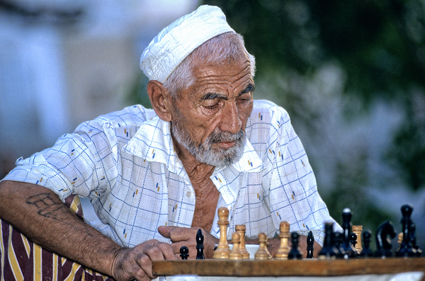 Elderly man plays chess in Bukhara Uzbekistan Digital Download