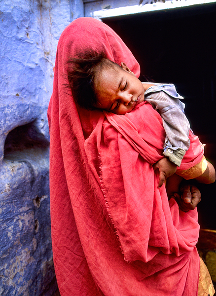 Mother carries sleeping child in India during daytime Digital Download