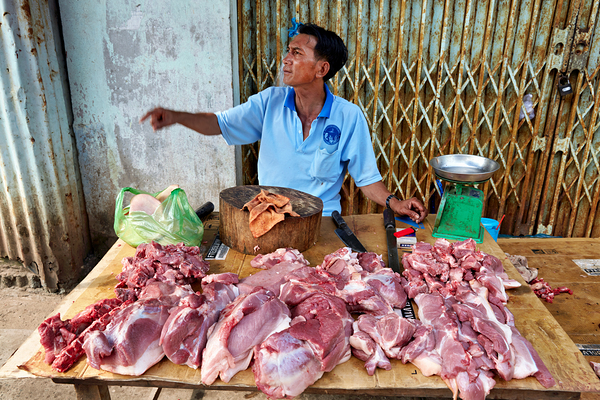 Local butcher selling meat in Phu Quoc market area Digital Download